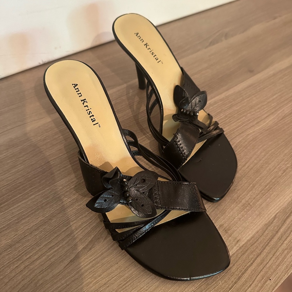 Ann Kristal “Mitzie” leather heels with butterfly detail.